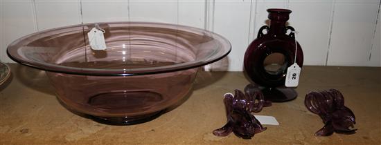 Large amethyst glass bowl, a pair of similar flower ornaments and a flask (4)
